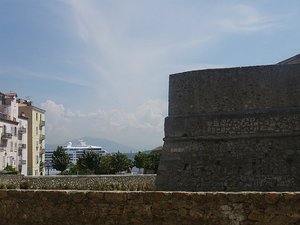 Ajaccio city wall with ship in distance