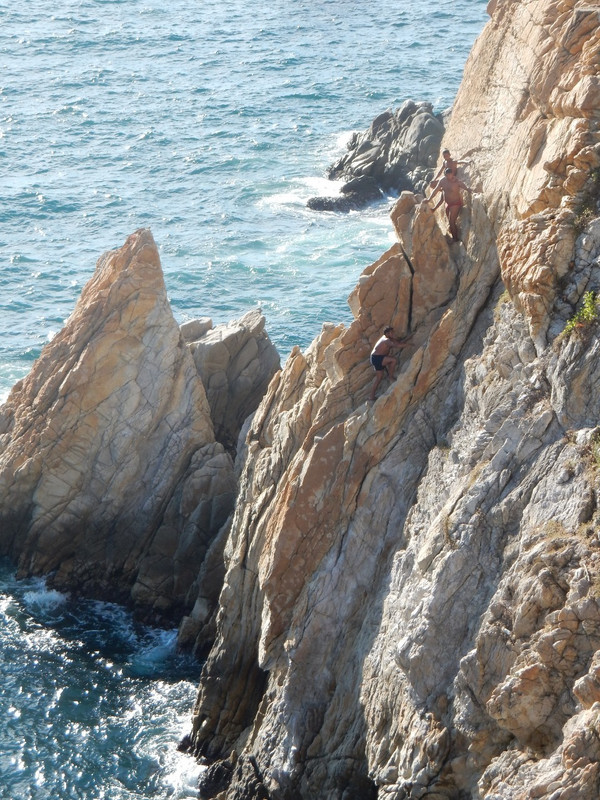 Divers climbing up the rocks