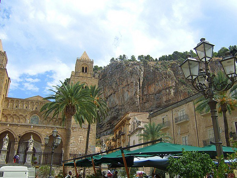 cefalu cathedral nestled against the mountain