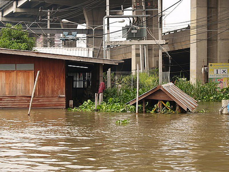 flooded housing with motorway above
