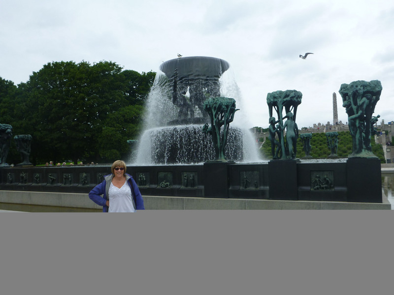 Tiz in front of frolicking nudes fountain