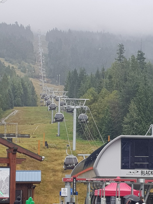 Chairlift disappearing into cloud