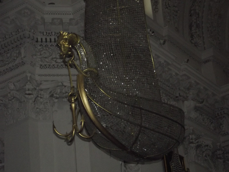 Crystal boat hanging from ceiling in church