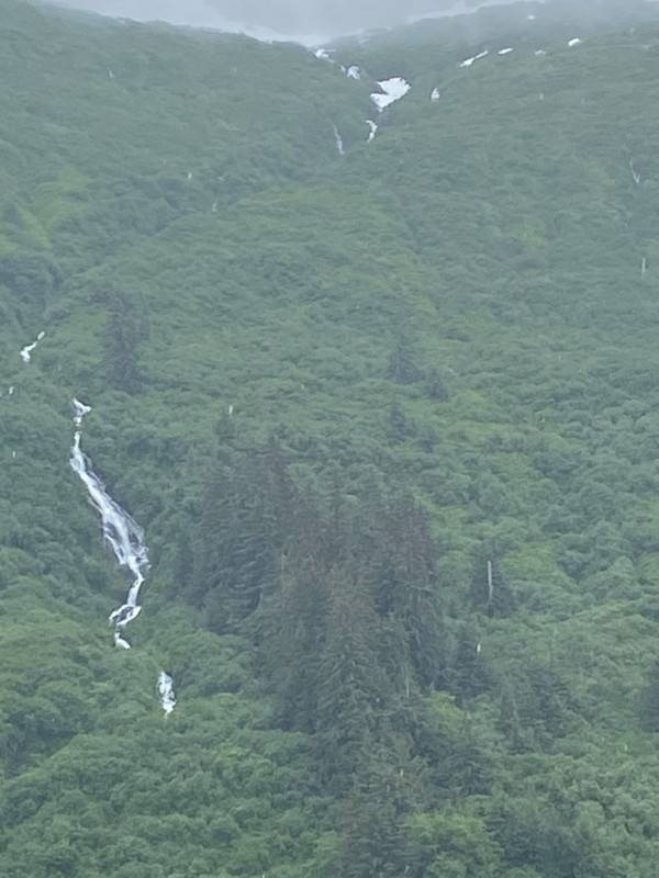 Waterfalls dotted the mountainsides