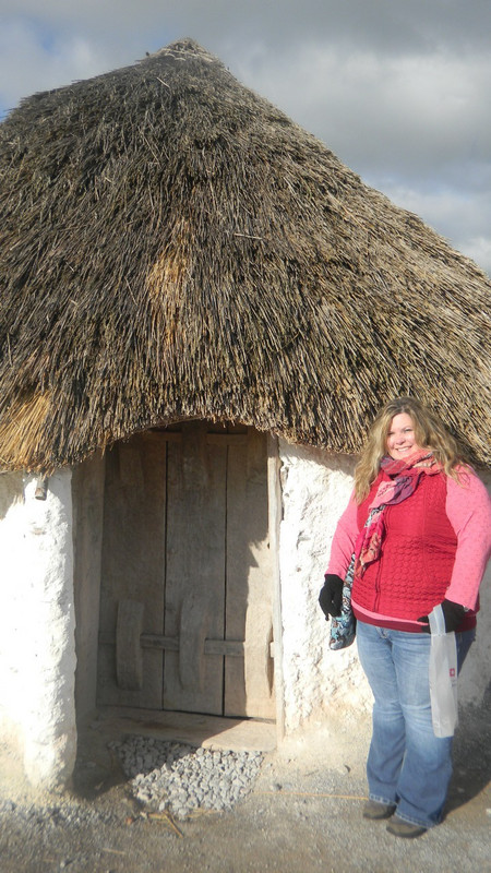 Me in front of a hut