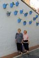 Barcy and Anne along a blue pot wall in Marbella