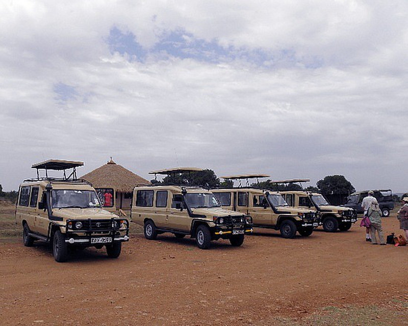 Safari vehicles at Mara airport