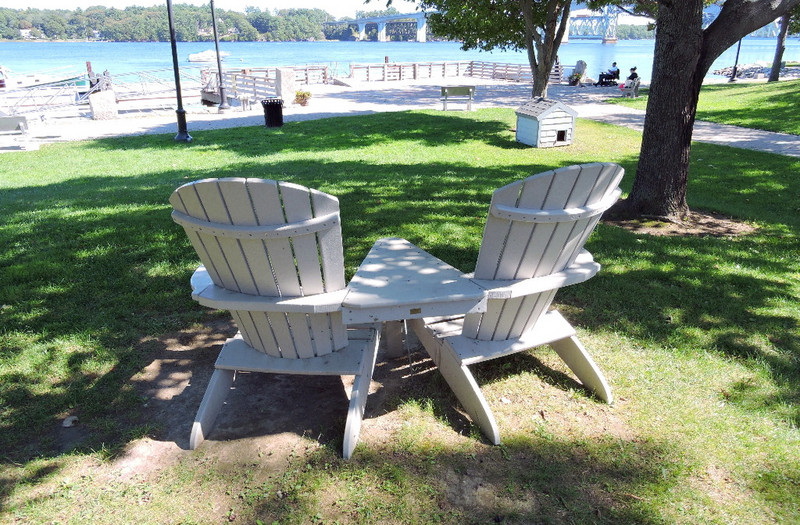 Dual Adirondack chairs with picnic table between
