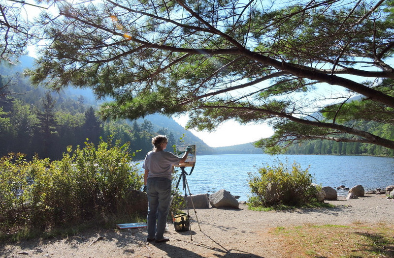 Photo of artist painting Bubble Pond, Acadia NP
