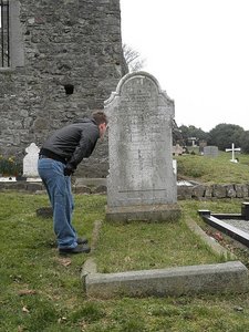 Chris lookin at a Gravestone