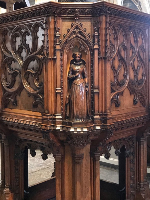 One of the carved figurines on the Pulpit
