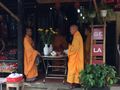 Monks offering blessing in a shop Hoi An