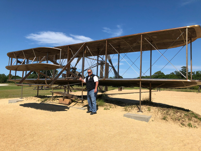 Jim with the Wright Flyer replica at Kill Devil Hills, NC
