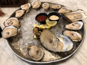 A dozen oysters at the BOURBON HOUSE in NO