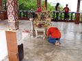 Man Praying at Shrine
