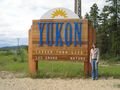 Cari At the Yukon Sign