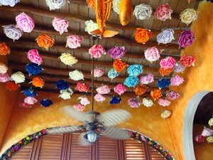 Dining room ceiling heavily decorated with paper roses