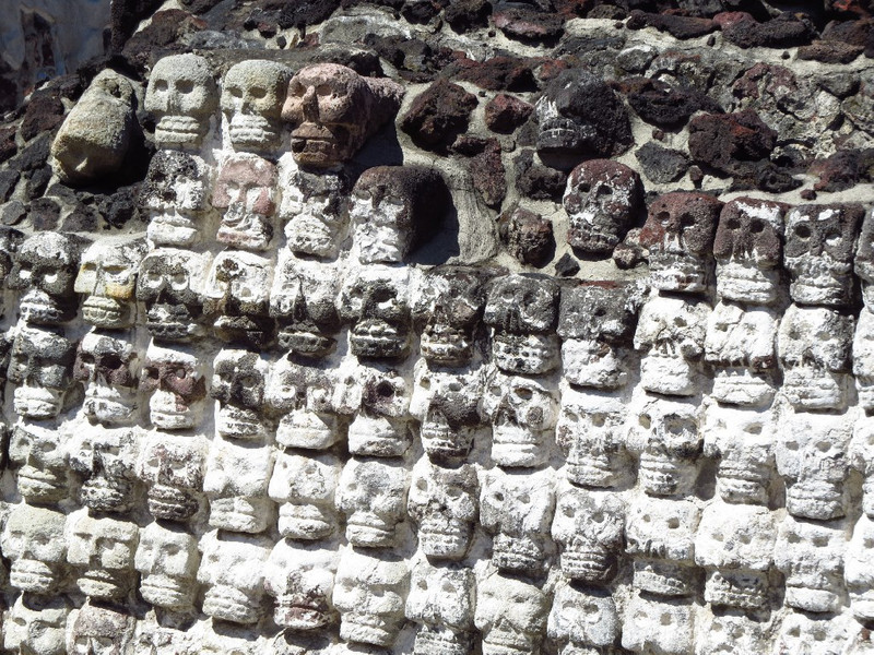 Wall of skulls made of clay.