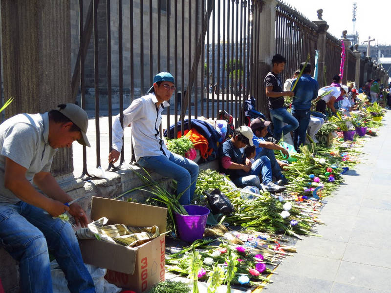 Palm sellers outside cathedral on Palm Sunday.