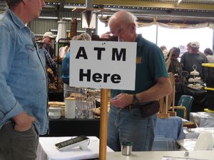 Human ATM at Boatshed market, reflects lack of permanent ATMs
