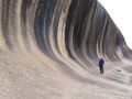 Jim standing under Wave Rock