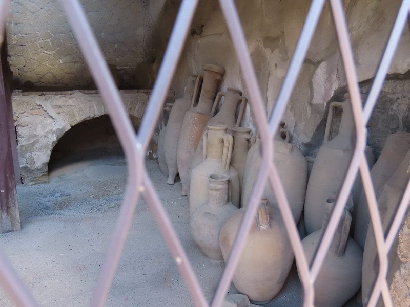 Amphorae survived the eruption in a shop