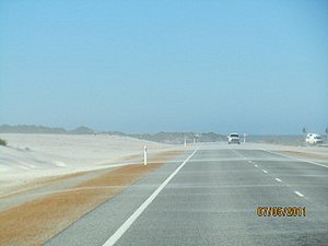 Sand blowing across road