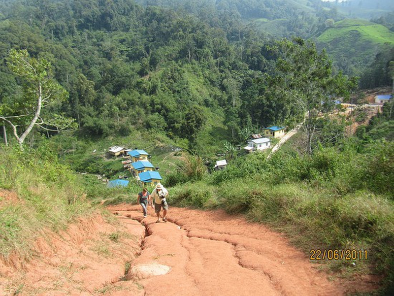 Climbing hill to Orang Asli village