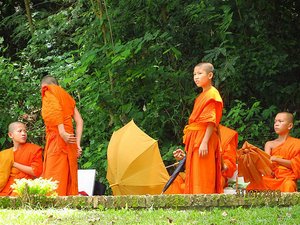 Novice monks resting in shade