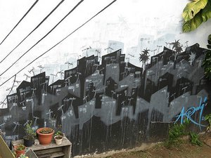 Urban Art on the garden wall ar Hostal Urbano