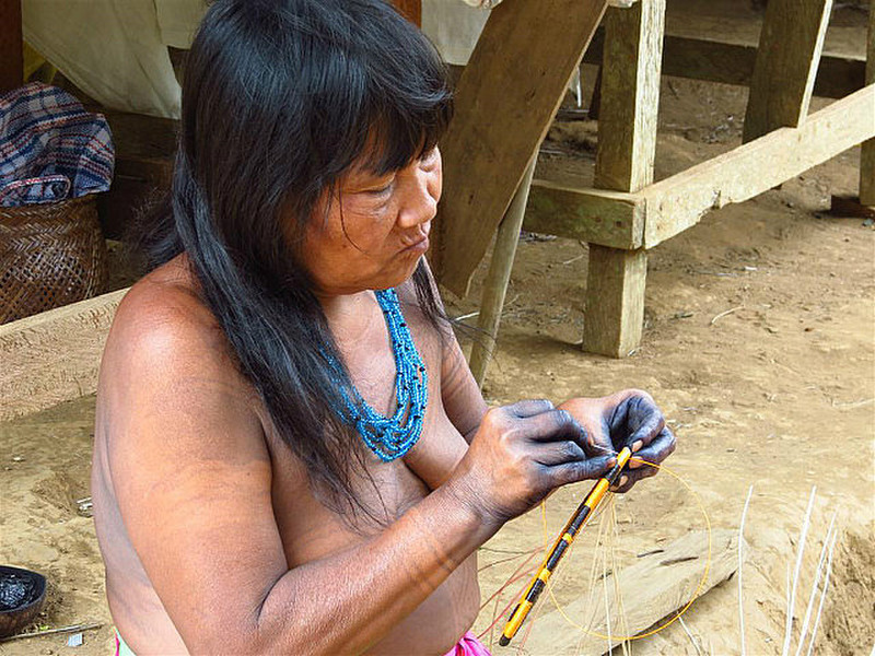 Embera woman basket making.