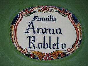 Traditional family name plaque outside houses