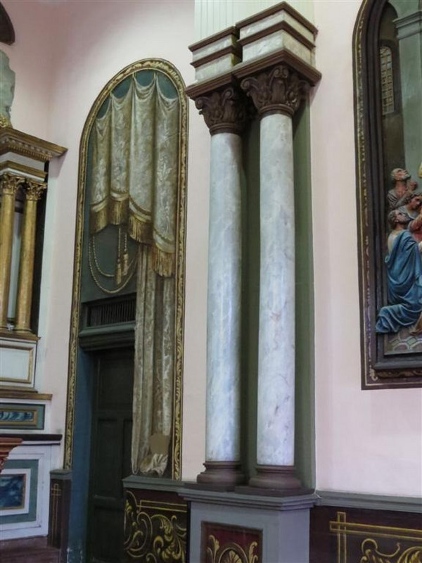 Pillars real but curtains and arch painted