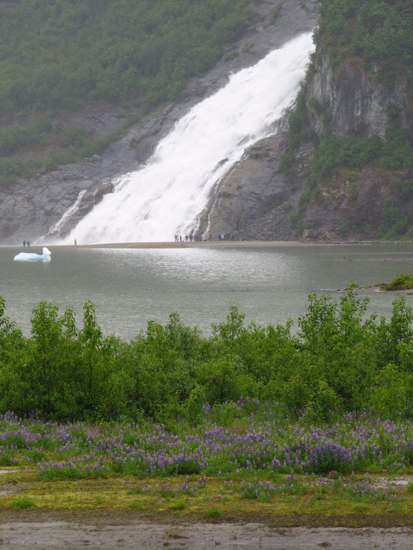 Waterfall into glacier lake.
