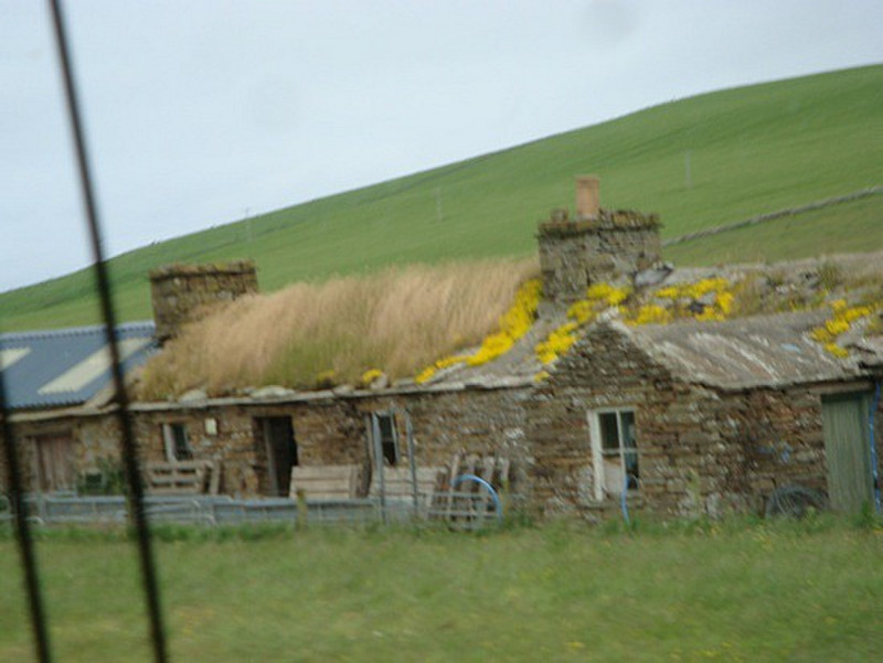 old Crofter&#39;s hut with thatch roof