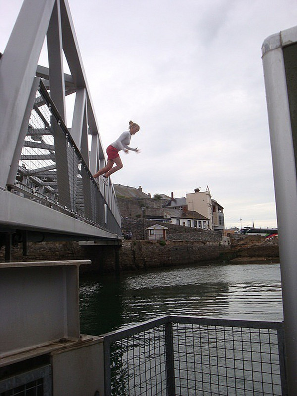 Kids jumping off of jetty in Plymouth Harbor
