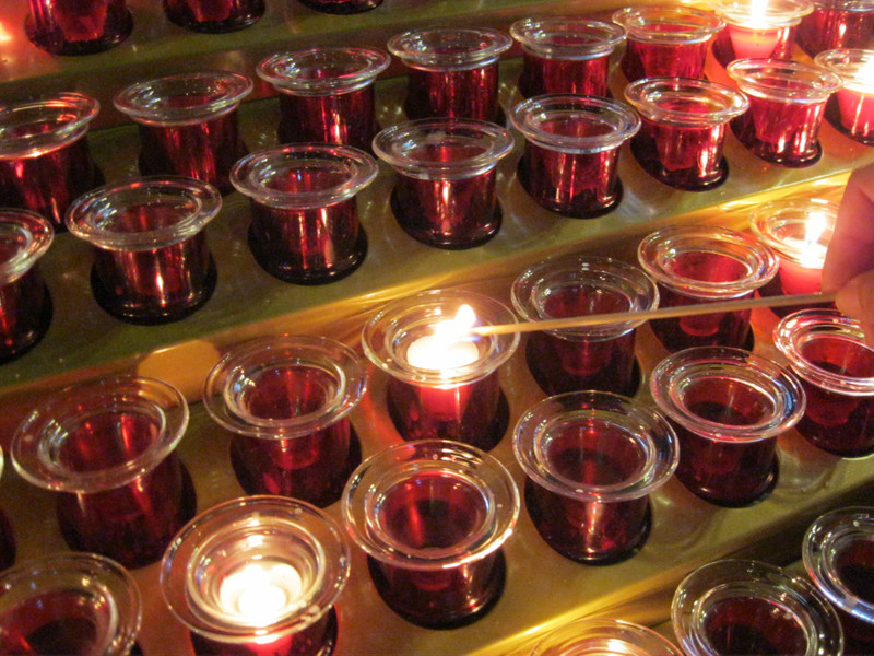 lighting a candle at Notre-Dame