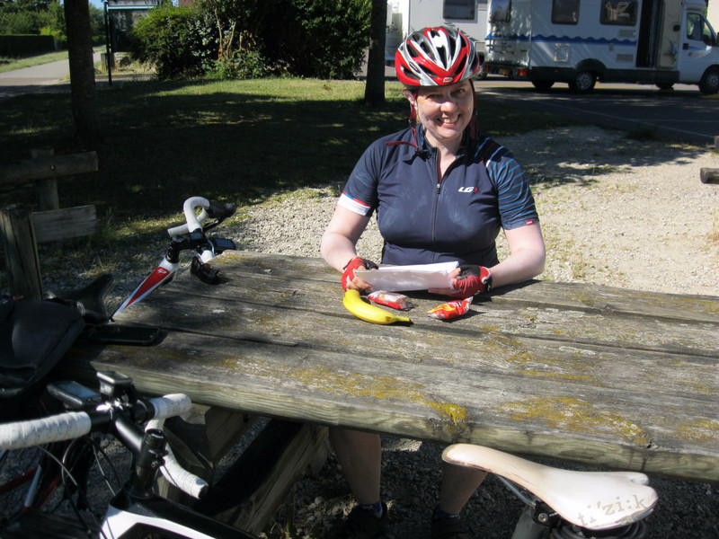 Caroline at picnic table in Givry where we stopped for lunch in 2011