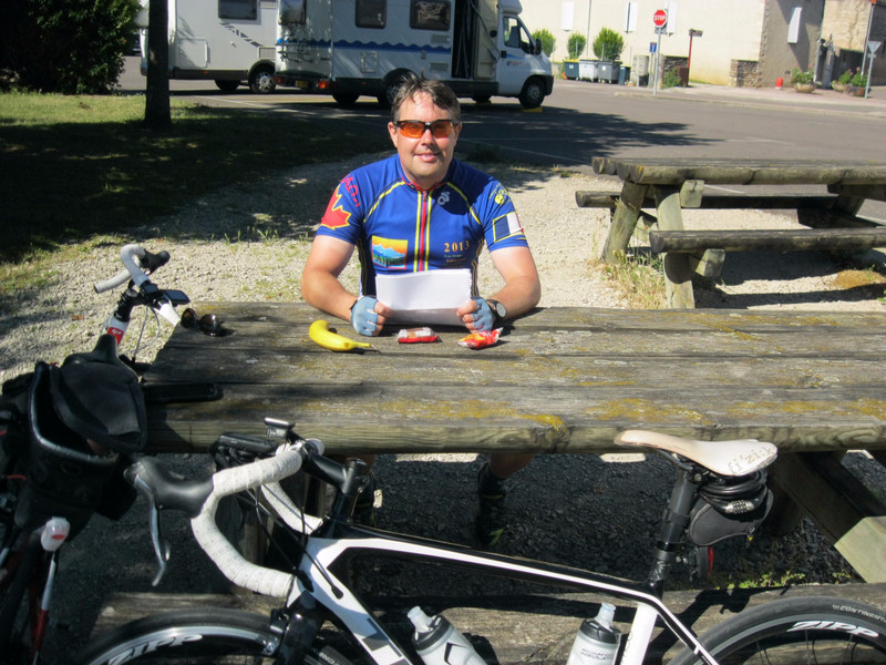 Tom at picnic table in Givry where we stopped for lunch in 2011