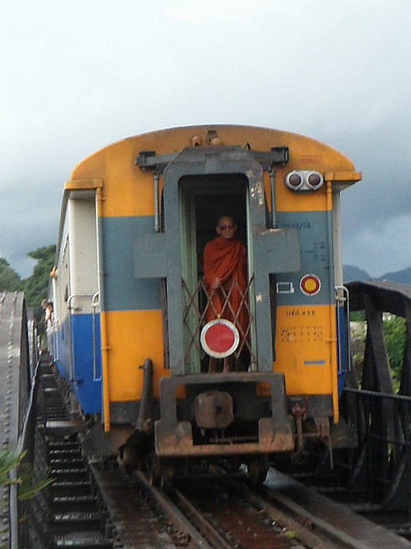 Monk on the train on the bridge