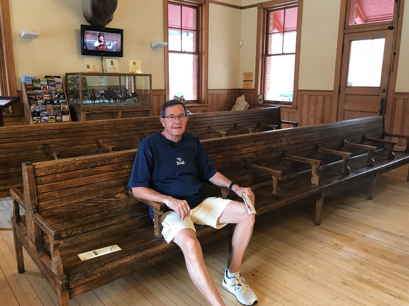 John in old waiting room in train station 