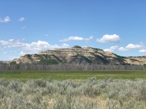 Badland formations and grassy plains