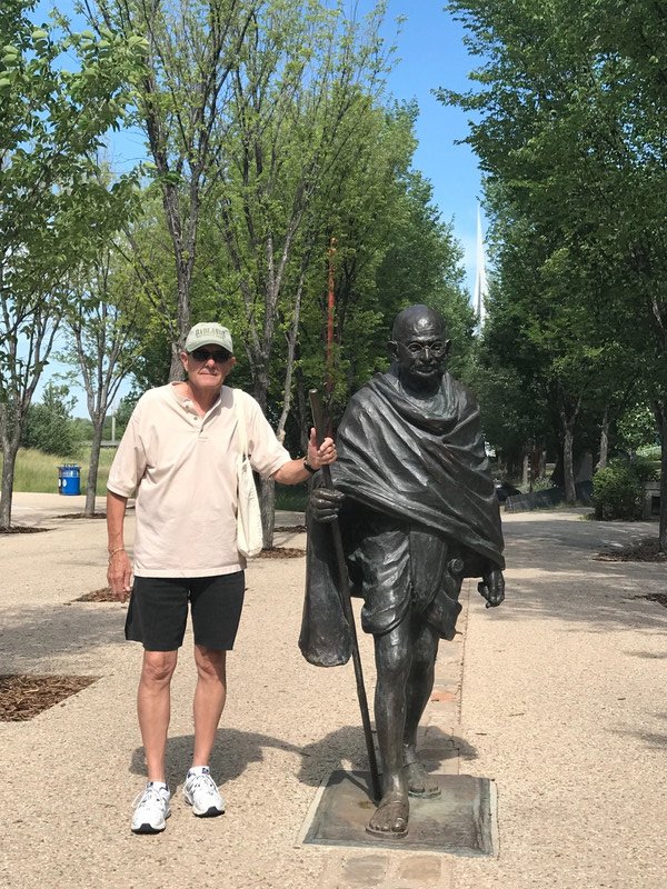 John with statue of Mahatma Ghandi