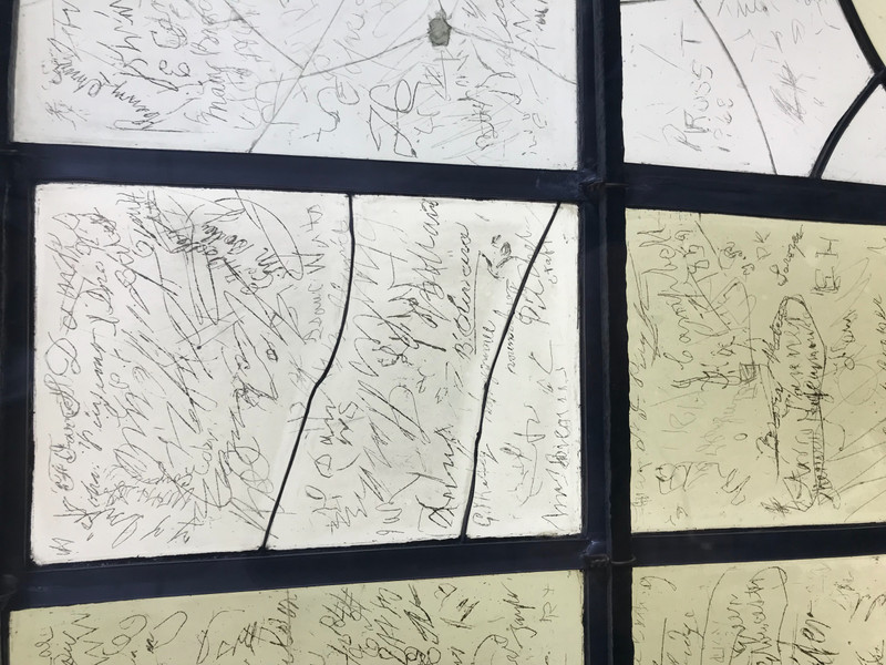 Close up of signatures on original glass