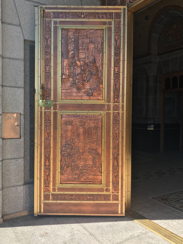 Copper door into Ste-Anne-de-Beaupre’