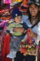 Bolivian girl brings baby to work