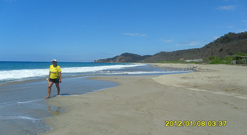 Ligia walks the beach at Solongo