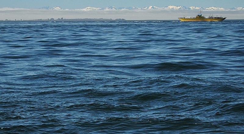 Ferry w/snow capped Andes in distance