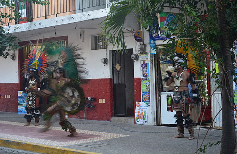 Feathered dancers in the street
