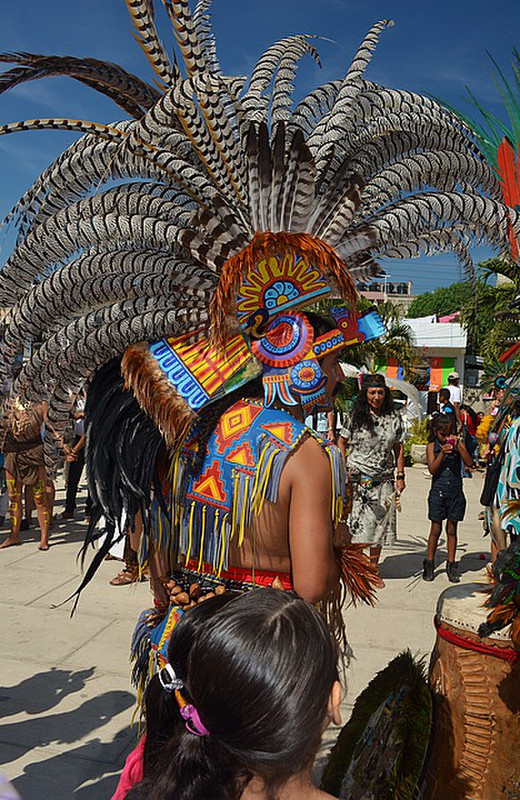Feathered dancers lead the procession